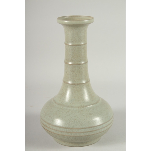 24 - A CHINESE CELADON GLAZE BOTTLE VASE, 22.5cm high.