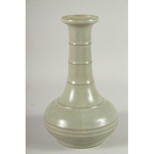 24 - A CHINESE CELADON GLAZE BOTTLE VASE, 22.5cm high.