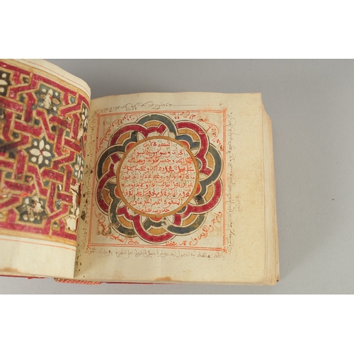 241 - A 19TH CENTURY MOROCCAN LEATHER BOUND DALA'IL AL KHAYRAT, with images of Mecca and Madina with medal... 