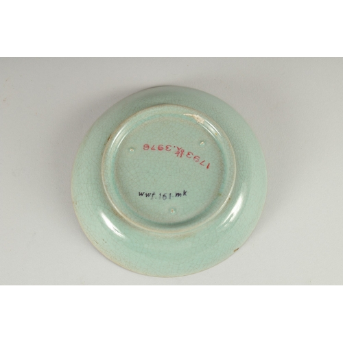 25 - A CHINESE CELADON GLAZE DISH, 14cm diameter.