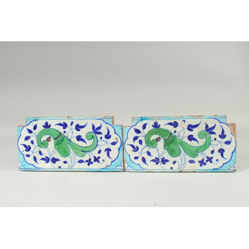 297 - A PAIR OF 18TH-19TH CENTURY MUGHAL NORTH INDIAN MULTAN POTTERY TILES, each 30cm x 15cm.