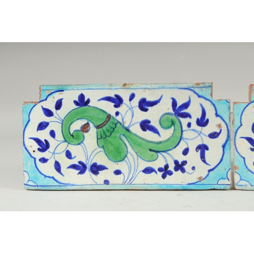 297 - A PAIR OF 18TH-19TH CENTURY MUGHAL NORTH INDIAN MULTAN POTTERY TILES, each 30cm x 15cm.