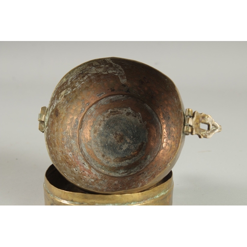 303 - A RAJASTHANI MUGHAL COPPER LIDDED CIRCUALR CADDY BOX, 19cm high, 12.5cm diameter.