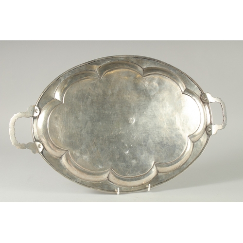 304 - A FINE SIGNED IRAQI NIELLO SILVER TWIN HANDLED TRAY, stamped to the centre, 53cm x 32cm.