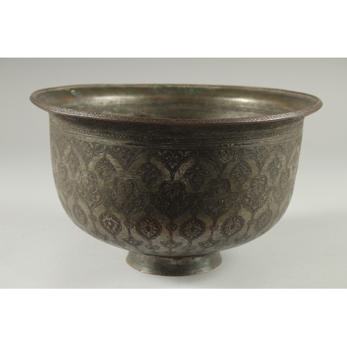 306 - A 16TH-17TH CENTURY SIGNED SAFAVID TINNED COPPER BOWL, engraved with decorative floral motifs, 25.5c... 