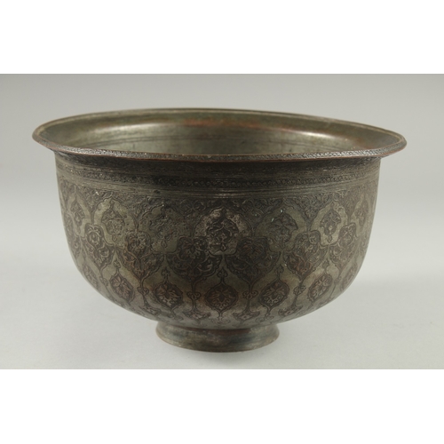 306 - A 16TH-17TH CENTURY SIGNED SAFAVID TINNED COPPER BOWL, engraved with decorative floral motifs, 25.5c... 