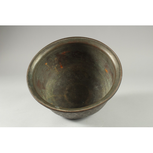 306 - A 16TH-17TH CENTURY SIGNED SAFAVID TINNED COPPER BOWL, engraved with decorative floral motifs, 25.5c... 