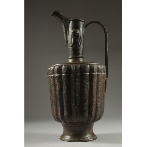 307 - A FINE LATE 12TH CENTURY KHURASAN PERSIAN SILVER AND COPPER INLAID BRASS EWER, the sheet metal beate... 