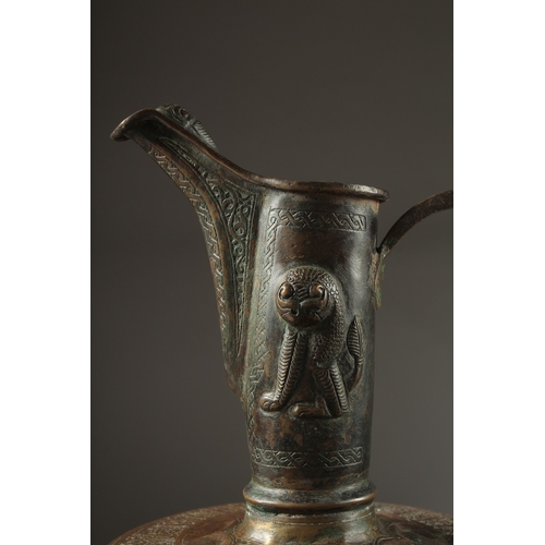 307 - A FINE LATE 12TH CENTURY KHURASAN PERSIAN SILVER AND COPPER INLAID BRASS EWER, the sheet metal beate... 