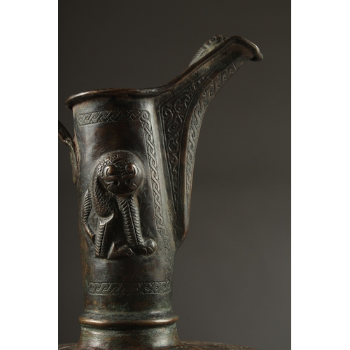 307 - A FINE LATE 12TH CENTURY KHURASAN PERSIAN SILVER AND COPPER INLAID BRASS EWER, the sheet metal beate... 