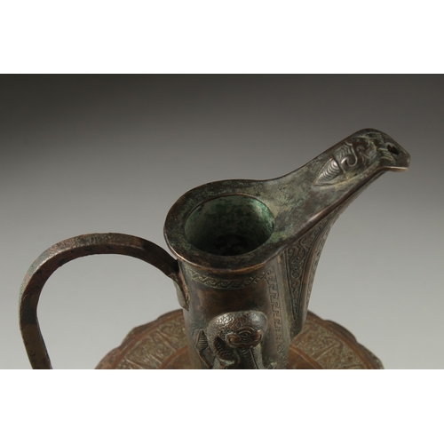 307 - A FINE LATE 12TH CENTURY KHURASAN PERSIAN SILVER AND COPPER INLAID BRASS EWER, the sheet metal beate... 