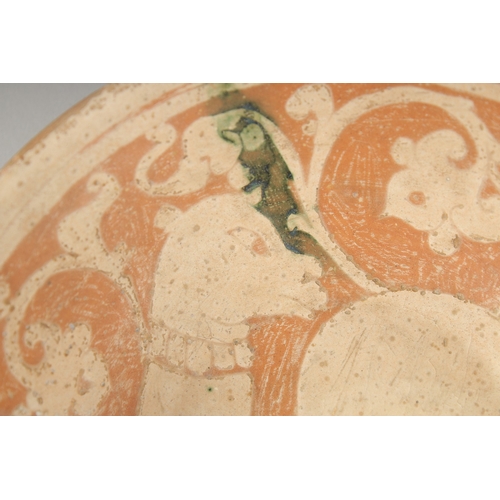 321 - A FINE RARE PERSIAN GARUS POTTERY BOWL - POSSIBLY 12TH-13TH CENTURY, with a camel design, 18cm diame... 