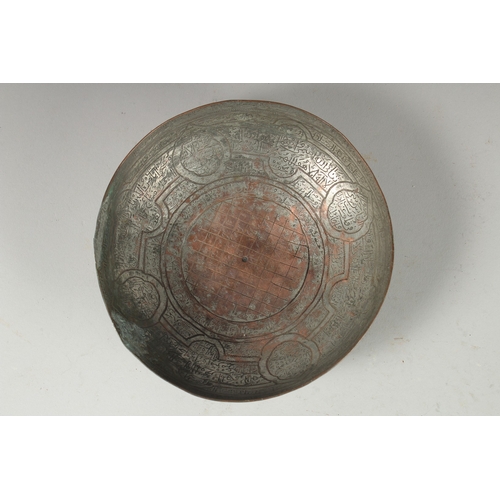 322 - A 18TH CENTURY PERSIAN TINNED COPPER MAGIC BOWL, 18.5cm diameter.