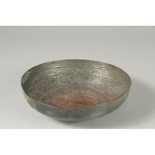 322 - A 18TH CENTURY PERSIAN TINNED COPPER MAGIC BOWL, 18.5cm diameter.