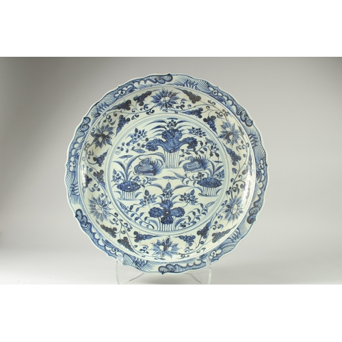 33 - A LARGE CHINESE BLUE AND WHITE PORCELAIN DISH, decorated with a central panel of ducks and flora, 51... 