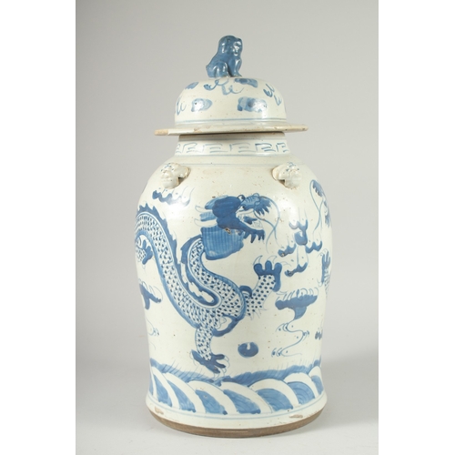 37 - A LARGE CHINESE BLUE AND WHITE PORCELAIN DRAGON JAR AND COVER, 47cm high.