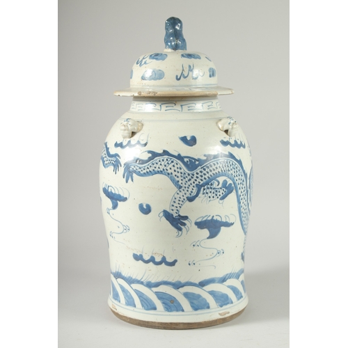 37 - A LARGE CHINESE BLUE AND WHITE PORCELAIN DRAGON JAR AND COVER, 47cm high.