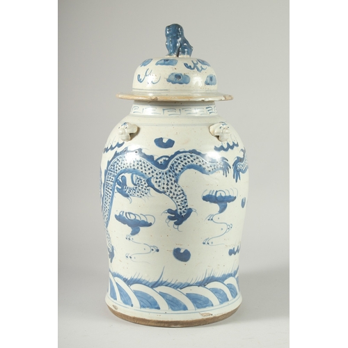 37 - A LARGE CHINESE BLUE AND WHITE PORCELAIN DRAGON JAR AND COVER, 47cm high.