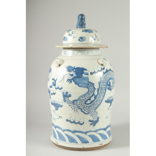 37 - A LARGE CHINESE BLUE AND WHITE PORCELAIN DRAGON JAR AND COVER, 47cm high.