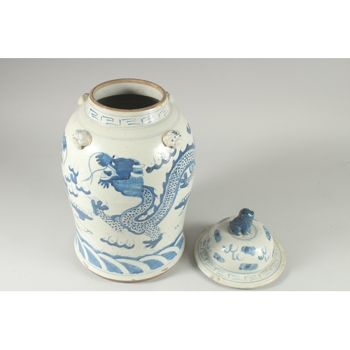 37 - A LARGE CHINESE BLUE AND WHITE PORCELAIN DRAGON JAR AND COVER, 47cm high.