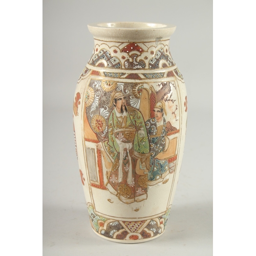 4 - A JAPANESE SATSUMA VASE, decorated with panels of figures, 24cm high.