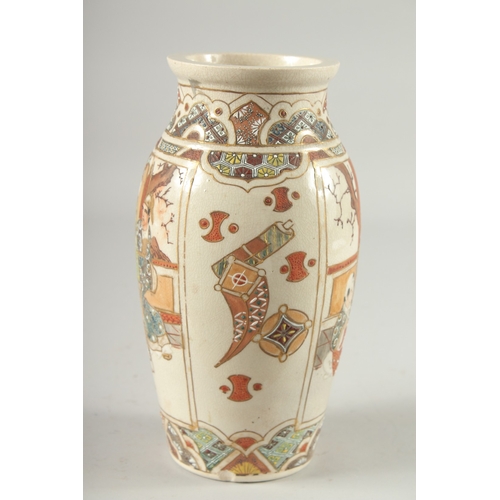 4 - A JAPANESE SATSUMA VASE, decorated with panels of figures, 24cm high.