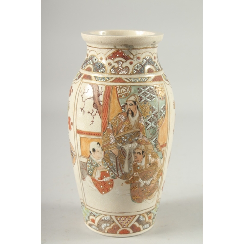 4 - A JAPANESE SATSUMA VASE, decorated with panels of figures, 24cm high.