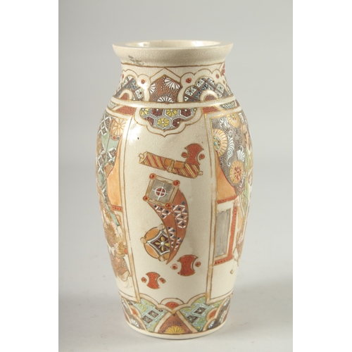 4 - A JAPANESE SATSUMA VASE, decorated with panels of figures, 24cm high.