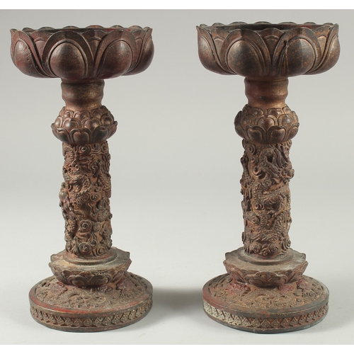 40 - A PAIR OF CHINESE ARCHAIC STYLE GILT BRONZE CANDLESTICKS, 28cm high.