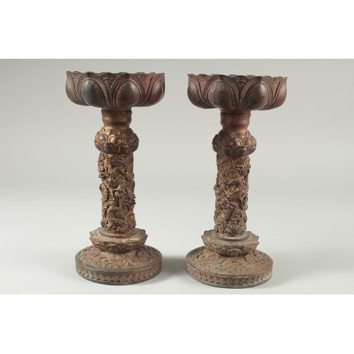 40 - A PAIR OF CHINESE ARCHAIC STYLE GILT BRONZE CANDLESTICKS, 28cm high.