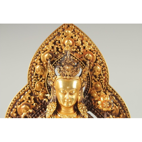 41 - A FINE TIBETAN GILDED ALLOY BUDDHA, 17cm high.