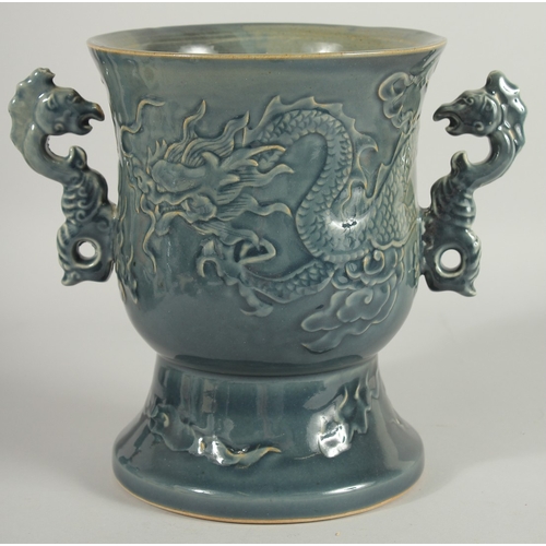 45 - AN IMPRESSIVE CHINESE TWIN HANDLE GOBLET VASE, the body carved with dragon, the handles formed as aq... 