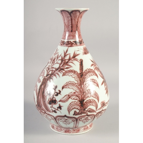 467 - A CHINESE COPPER RED AND WHITE PORCELAIN YUHUCHUNPING VASE, painted with native flora, 31.5cm high.