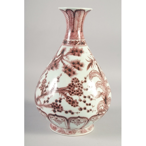 467 - A CHINESE COPPER RED AND WHITE PORCELAIN YUHUCHUNPING VASE, painted with native flora, 31.5cm high.