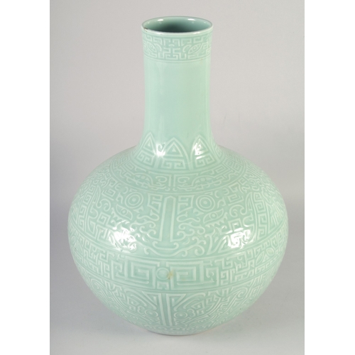 470 - A VERY LARGE CHINESE CELADON GLAZED PORCELAIN VASE, with carved decoration and six-character mark to... 