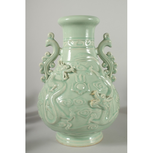 471 - A LARGE CHINESE CELADON GLAZE TWIN HANDLE VASE, with moulded relief dragons, mark to base, 39cm high... 