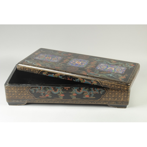 472 - A LARGE CHINESE BLACK LACQUERED WOOD RECTANGULAR BOX, painted with panels of foliate motifs and bats... 