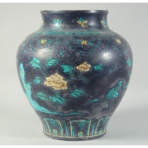 49 - A LARGE CHINESE FAHUA-TYPE PORCELAIN JAR, painted with flowers and lucky symbols, 34cm high.