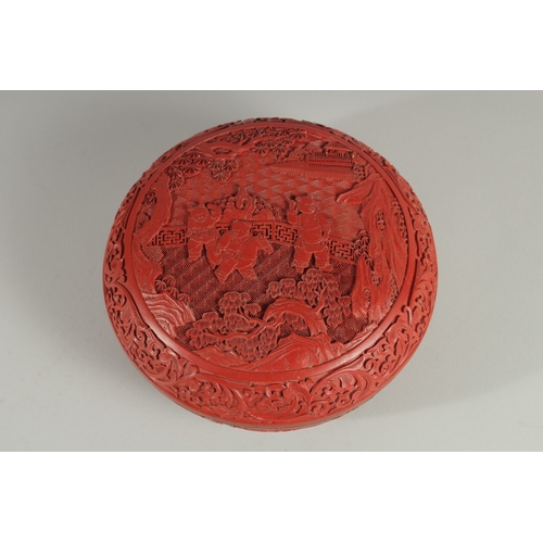 7 - A CHINESE CINNABAR LACQUER CIRCULAR BOX AND COVER, the lid with panel depicting boys playing in a co... 