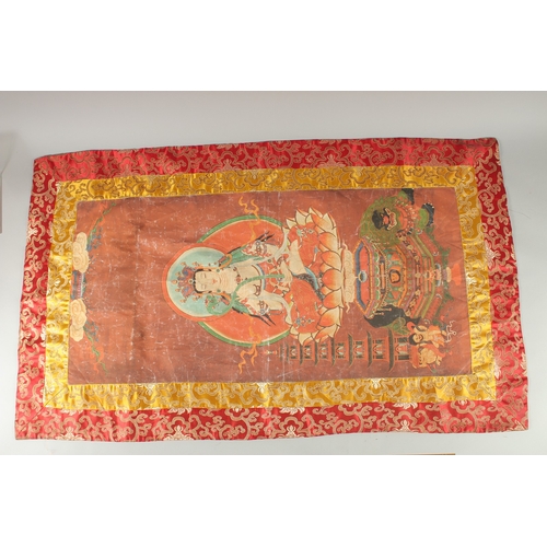 74 - A TIBETAN THANGKA MOUNTED ON SILK.