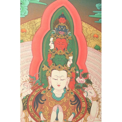 75 - A TIBETAN THANGKA MOUNTED ON PAPER.