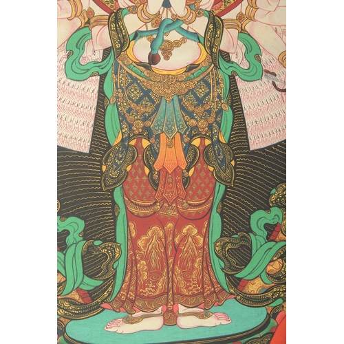 75 - A TIBETAN THANGKA MOUNTED ON PAPER.