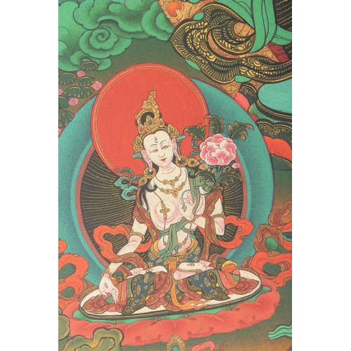 75 - A TIBETAN THANGKA MOUNTED ON PAPER.