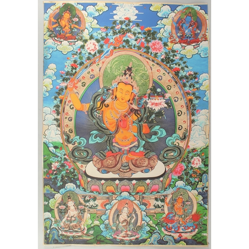 76 - A TIBETAN THANGKA MOUNTED ON PAPER.