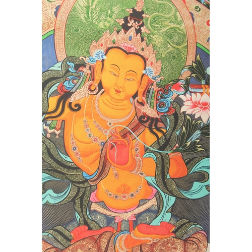 76 - A TIBETAN THANGKA MOUNTED ON PAPER.