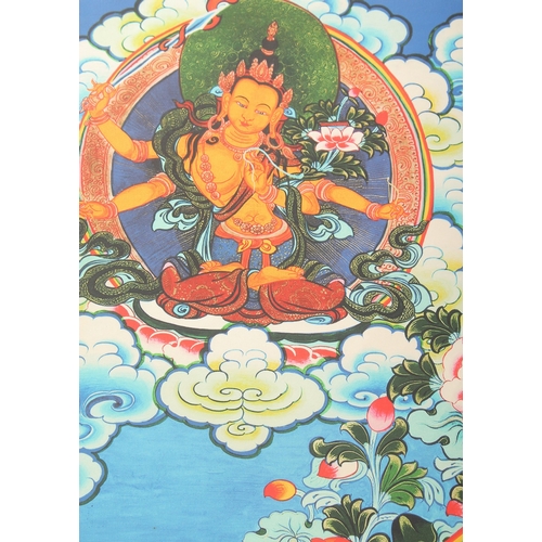 76 - A TIBETAN THANGKA MOUNTED ON PAPER.