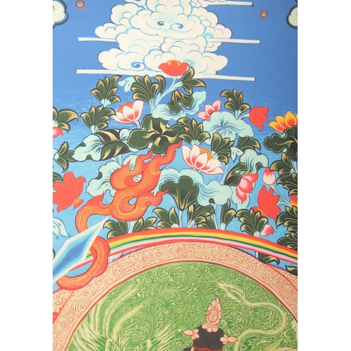 76 - A TIBETAN THANGKA MOUNTED ON PAPER.