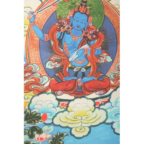 76 - A TIBETAN THANGKA MOUNTED ON PAPER.