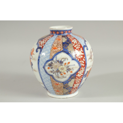 82 - A FINE JAPANESE IMARI PORCELAIN BULBOUS VASE, beautifully painted with panels of birds and native fl... 