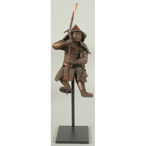 86 - A 19TH CENTURY JAPANESE OKIMONO OF A SAMURAI, elevated on a purpose-made display stand, figure 17cm ... 